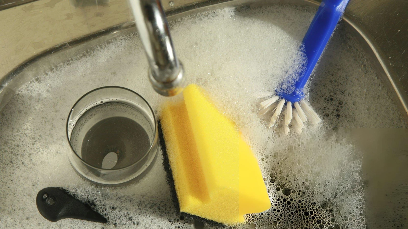 Selection of kitchen cleaning brushes including dish, cup and bottle brushes